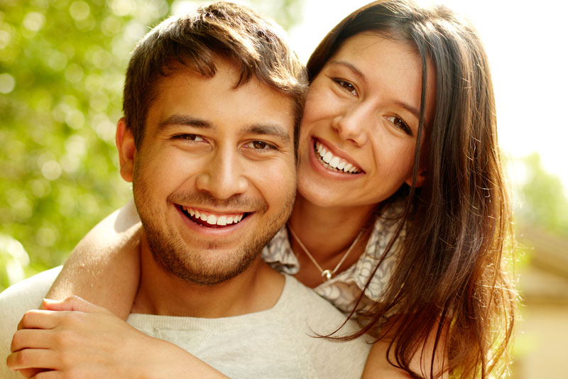Dental Patients Smiling With Well Cared For Dental Implants In Albuquerque, NM
