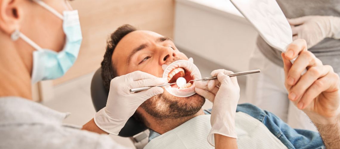 a gum disease patient being checked for periodontal disease by an expert dentist.